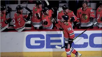  ?? (AP PHOTO/PAUL BEATY) ?? Chicago Blackhawks' Connor Bedard (98) is congratula­ted for his goal against the Anaheim Ducks during the second period of Tuesday’s game, in Chicago.