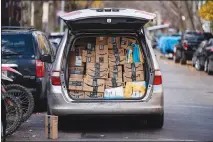  ?? KARSTEN MORAN / THE NEW YORK TIMES ?? Amazon packages fill a delivery vehicle Nov. 28 in New York. For concerned customers, avoiding one of the world’s largest retailers and web service providers is proving harder than expected.