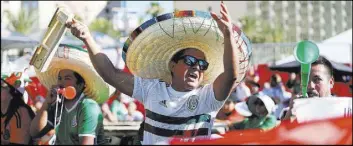  ?? Erik Verduzco Las Vegas Review-Journal @Erik_Verduzco ?? Milo Nino, center, cheers during a watch party for a World Cup match between Mexico and South Korea at the Downtown Las Vegas Events Center on June 23.