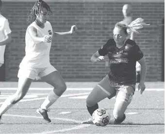  ?? STAFF PHOTO BY TIM BARBER ?? Chattanoog­a FC’s Carlie Banks, right, regains control of the ball from the Nashville Rhythm’s Carly Paschall in the first half of Sunday night’s game at Finley Stadium. Banks scored in the 38th minute to send the match to halftime tied 1-1, and CFC...