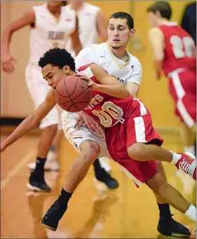  ?? SEAN D. ELLIOT/THE DAY ?? Stonington’s Lennox Deer, back, fouls St. Bernard’s De’Andre Williams in ECC boys’ basketball action Tuesday at Stonington. Go to www.theday.com to see a photo gallery from the game.