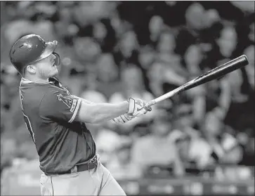  ?? Bob Levey Getty Images ?? SLUGGER Mike Trout homers in the eighth inning off Houston reliever Hector Rondon to give the Angels a 5-2 lead. The run proved to be decisive as Yuli Gurriel added a two-run home run in the eighth for the Astros.