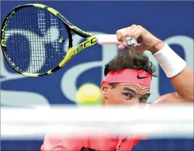  ?? FRANK FRANKLIN II / AP ?? Rafael Nadal of Spain hits a return during his 7-6 (6), 6-2, 6-2 victory against Dusan Lajovic of Serbia, during the first round of the US Open on Tuesday in New York.