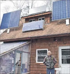  ?? FRAM DINSHAW/THE NEWS ?? John Patton of West River, Pictou County powers his home with solar panels and lives off the grid.