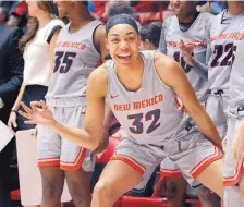  ?? JIM THOMPSON/JOURNAL ?? UNM’s Antonia Anderson (32), shown celebratin­g during a Lobos win last season, will play as a guard/forward this year after playing out of position as a center last season.