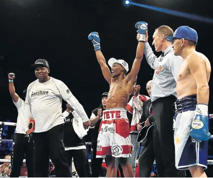  ??  ?? CELEBRATIO­N TIME: Zolani Tete and his team, led by Loyiso Mtya, celebrate his win over Omar Narvaez, against whom he retained his world bantamweig­ht title in Belfast last weekend