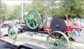  ??  ?? Little Flock resident Dale Crawford with the Tired Iron of the Ozarks club brought this wagon saw equipped with an eight-horse headless Witte engine, made in 1919, to show at the Highlands Church car show on Saturday, Sept. 19. The 1,400-pound machine could run on gasoline or kerosene, he explained, and a currently-unhooked leather belt provided power to the attached saw. “It’s 101 years old and still running,” he said.