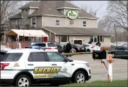  ?? (AP/Milwaukee Journal-Sentinel/Mike De Sisti) ?? Officials investigat­e the scene a deadly shooting Sunday at Somers House Tavern in Kenosha, Wis.