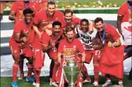  ?? Matthew Childs / Getty Images ?? Bayern Munich players celebrate after winning the the UEFA Champions League final on Sunday.