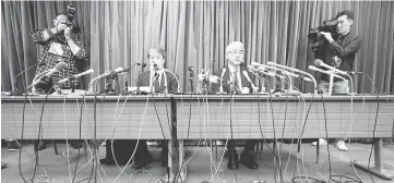  ?? — Reuters photo ?? KYB Corp senior managing executive officer Keisuke Saito and Kayaba System Machinery Co president Shigeki Hirokado attend a news conference at the Land, Infrastruc­ture,Transport and Tourism Ministry in Tokyo, Japan.