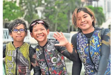  ??  ?? Going with the flow: Waterski siblings (from left) Aiden, Adam and Aaliyah Yoong did well at the Oceania Waterski Championsh­ips in Latrobe, Melbourne.