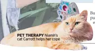  ??  ?? PET THERAPY Niamh’s cat Carrott helps her cope
