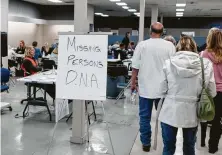  ?? Jason Henry / New York Times ?? A government services center set up in a former department store in Chico, Calif., includes a place for relatives of missing people to drop off DNA samples to help with identifica­tion.