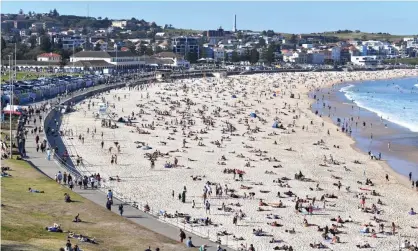  ?? Photograph: Dean Lewins/EPA ?? Covid-safe crowd control measures will be brought in this summer to prevent overcrowdi­ng at beaches, including Bondi.