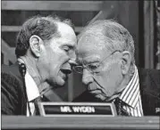  ?? SUSAN WALSH/AP ?? Sens. Ron Wyden, D-Ore., left, and Chuck Grassley, RIowa, forged a compromise on the prescripti­on drug bill.