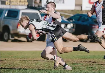  ?? ?? Nyora’s Blake Boyd lays a tackle on Poowong’s Alex Henshall.