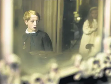  ?? Nicola Dove Focus Features ?? OLIVER ZETTERSTRO­M plays young Faraday in Lenny Abrahamson’s “The Little Stranger.” The boy’s visit to a manor affects him.