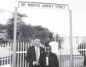  ??  ?? Prime Minister Andrew Holness and Culture Minister Olivia ‘Babsy’ Grange at the unveiling of a sign marking the renaming of a road in the Namibian capital Windhoek in honour of Jamaica’s National Hero Marcus Garvey, on July 23.