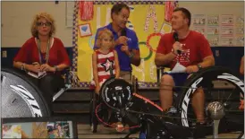  ?? Kristina Wilder / Rome News-Tribune ?? Johnson Elementary Principal LaDonna Turrentine (from left), Sarah Schabort, her father Krige Schabort and PE coach Sam Couch talk about Schabort’s upcoming trip to the Paralympic­s.