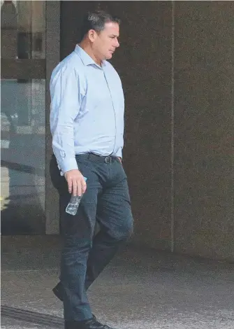  ??  ?? Brendon Crowley leaves court after giving evidence in the Bryan Byrt hearing. LIAM WALSH