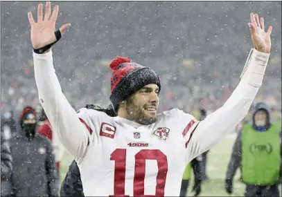  ?? MATT LUDTKE — THE ASSOCIATED PRESS ?? The 49ers’ Jimmy Garoppolo celebrates Saturday after his team beat Green Bay 13-10to advance to the NFC Championsh­ip game. For more on 49ers win on Saturday and upcoming game against the Rams, see page B1