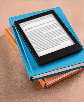 ?? Getty Images ?? Books often cost libraries about $15 each, but e-books are costing them three times as much, prompting librarians to call for change.
