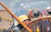  ?? AFP ?? Protesters pelt stones during a clash wth security forces in Darjeeling on Saturday.