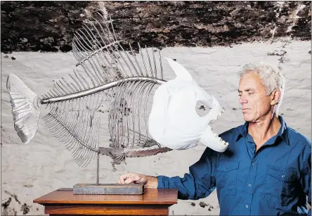  ??  ?? River Monsters host Jeremy Wade and a reconstruc­tion of a Mega Piranha.