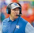  ?? PHOTO BY THE ASSOCIATED PRESS ?? Kentucky football coach Mark Stoops will try to lead the Wildcats to their first win of the season when they face New Mexico State on Saturday. The Wildcats are 0-2 for the first time since 1996, and Stoops has pledged to become more involved on...