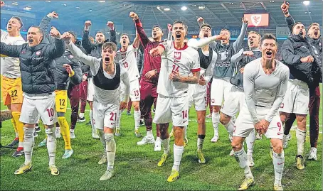  ?? AP ?? Poland players celebrate after defeating Wales in a penalty shoot out during their Euro play-off match at Cardiff City Stadium, Wales.