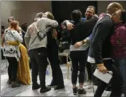  ??  ?? Attendees embrace during an alcohol-free social evening sponsored by The Shine at a hotel in the Williamsbu­rg neighborho­od of the Brooklyn borough of New York.