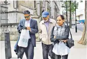  ??  ?? On trial: Navinder Sarao arrives for the judgment in his extraditio­n hearing at Westminste­r magistrate­s’ court after being accused by the US of wire and commoditie­s fraud and market manipulati­on. Above, his family outside court