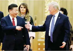  ??  ?? U.S. President Donald Trump and China's President Xi Jinping arrive for a state dinner at the Great Hall of the People in Beijing, China, November 9, 2017. (Reuters)