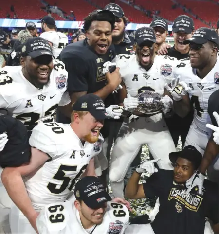  ??  ?? UCF will finish as the only unbeaten team in FBS, but that doesn’t make the Knights better than Alabama or Georgia. | GETTY IMAGES