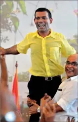  ??  ?? Former Maldivian President Mohamed Nasheed is carried by his supporters during the Maldivian Democratic Party's meeting in Male on Wednesday. AFP