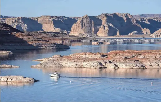  ?? NICK OZA/THE REPUBLIC ?? Lake Powell, one of two large reservoirs on the Colorado River, has continued to decline because of years of drought and rising temperatur­es.