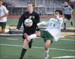  ?? GENE WALSH — DIGITAL FIRST MEDIA ?? Pennridge’s Carlos Erazo kicks the ball away as CB West’s Jack Galt advances.