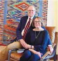  ?? SOURCE: EASTERN NEW MEXICO UNIVERSITY ?? ENMU alumna and philanthro­pist Dr. Gay Su Pinnell and husband Jeff Forster sit in front of the award-winning Navajo rug made by ENMU alumnus and master weaver Irvin Trujillo on display inside the newly dedicated Casa del Sol Event Facility.