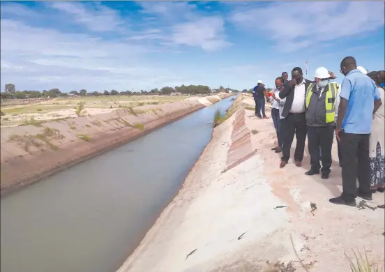  ?? Photo: Nuusita Ashipala ?? In the pipeline… Water minister Calle Schlettwei­n during a recent visit to the Calueque-Oshakati canal at Omahenene.