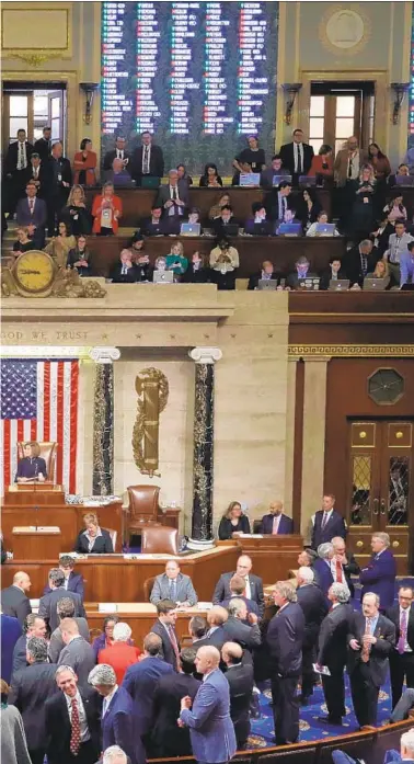  ?? Chip Somodevill­a Getty Images ?? Trump as Speaker Nancy Pelosi presides, capping an 11-hour session filled with impassione­d, rancorous debate.