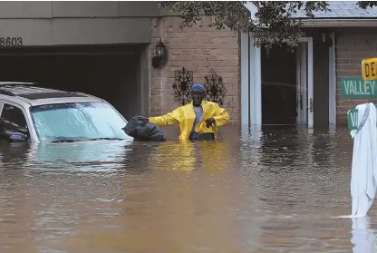  ?? GETTY IMAGES PHOTO, ABOVE; PHOTO, BELOW, COURTESY OF MIKE WILLIAMS ?? LONE STAR SUFFERING: With many Texas residents being evacuated after flooding, above, former Herald copy editor Mike Williams, a Boston transplant, says many people there are ‘truly helpless.’