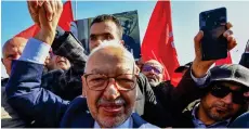  ?? Photo: AFP ?? In this file photo taken on 21 February 2023, the head of Tunisia’s Islamist movement Ennahdha Rached Ghannouchi arrives at a police station in Tunis.
