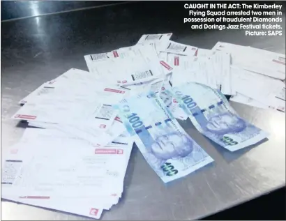  ??  ?? CAUGHT IN THE ACT: The Kimberley Flying Squad arrested two men in possession of fraudulent Diamonds and Dorings Jazz Festival tickets. Picture: SAPS