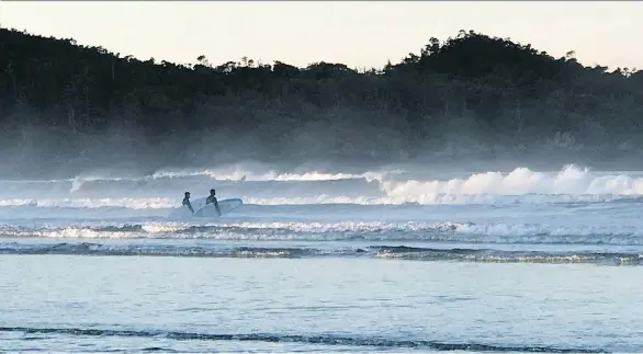  ?? PHOTOS: VANESSA PINNIGER ?? Tofino is well-known for its world-class surfing — and its freezing-cold rain this time of year. But that didn’t stop wellness-seekers from suiting up to hit the sand.