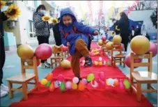  ?? KUANG LINHUA / CHINA DAILY ?? A welcoming ceremony is held for students returning to Beijing Chaoshen Kindergart­en (Huizhong branch) on Feb 21 for the new semester. Kindergart­en, primary and secondary school pupils in Beijing all returned to school on Feb 21.