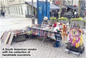  ??  ?? A South American vendor with his collection of handmade souvenirs.