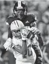  ??  ?? Judson’s Antony Shelton hauls in a long pass in front of Steele’s Jamariyon Bateman to set up a score.