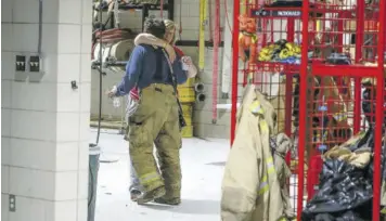  ?? (Photo: AP) ?? Members of the Winterset Fire Department embrace after a long evening responding to emergency calls after a tornado touched down west of Winterset, Iowa, killing multiple people and levelling homes on Saturday