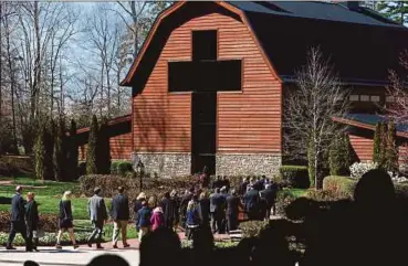  ?? AFP PIC ?? Pallbearer­s carrying the casket of Billy Graham at his funeral service at the Billy Graham Library in Charlotte, North Carolina, on Friday.