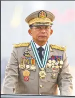  ??  ?? Myanmar’s Commander-in-Chief Senior Gen. Min Aung Hlaing presides over an army parade March 27 on Armed Forces Day in Naypyitaw.